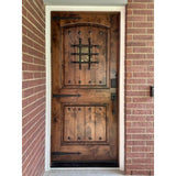 Mediterranean Knotty Alder Arch Top Speakeasy Exterior Door